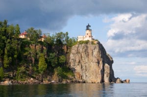 Lighthouse on top of cliffside overlooking Lake Superior